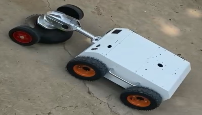 Wheeled robot platform with cutting attachment on concrete
